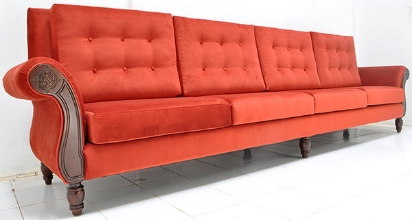 red velvet and teak couch