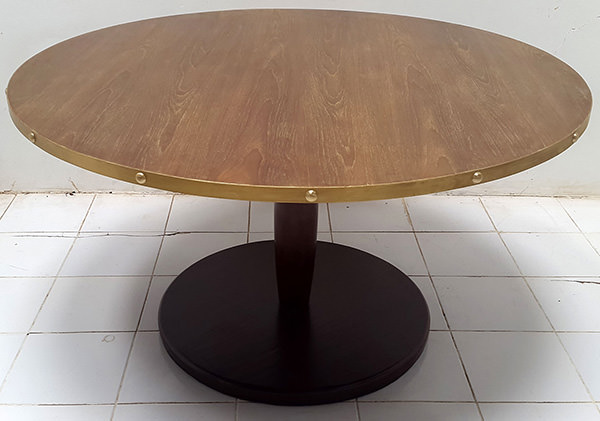 round restaurant table with brass edges and dark brown leg