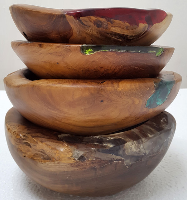 set of teak and colored resin plates