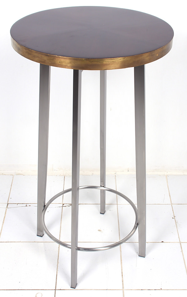 Bar table with stainless steel slender legs and brass edges