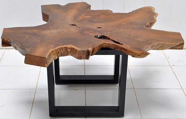 solid teak table top with a natural shape and iron legs