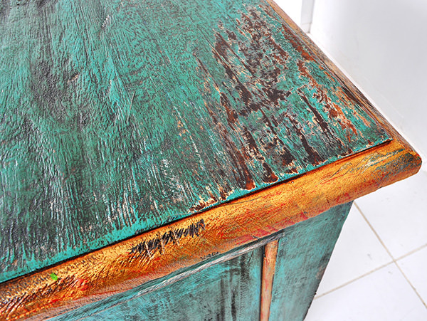green mahogany painted cabinet with brass handle and vintage finish