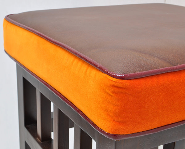brown leather and orange fabric cushion for teak bar stool
