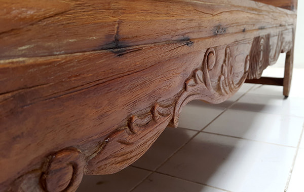 teak bench with carvings