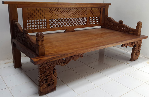 traditional asian teak bench with carvings