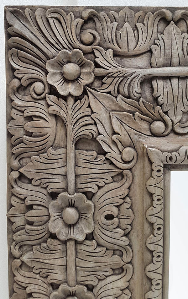 long carved mirror with flower pattern