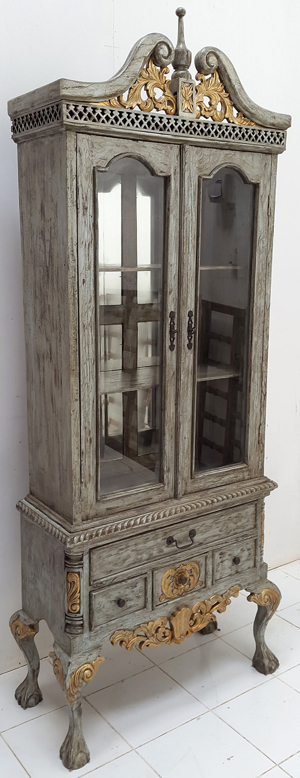 carved wooden wardrobe with a vintage finish