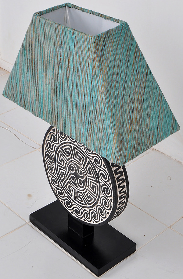 Night lamp with traditional papuan handicraft wood carvings