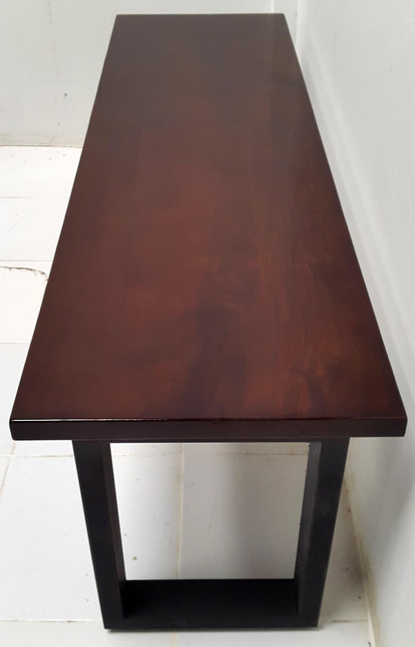 dark brown wooden table with black iron legs