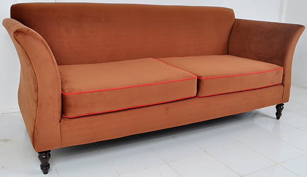 Scandinavian couch with brown velvet upholstery