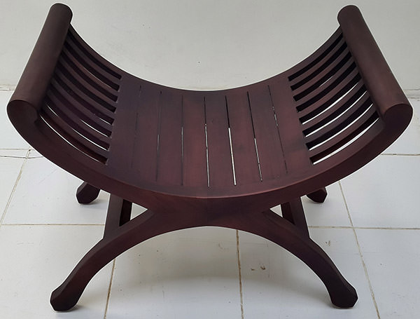 teak garden stool with curved arms and dark brown finish