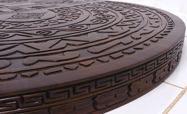 indoor timber restaurant table top with carvings