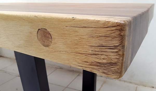 suar wood with a metal dowel insert