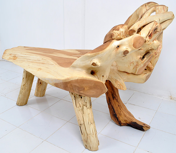 teak root bench with natural shapes and light finishing