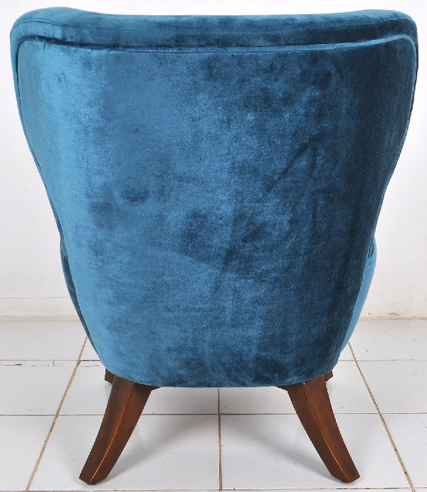 curved blue velvet back lounge seat with mahogany wooden legs
