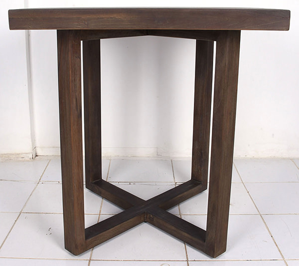 round dining table with X-shaped legs with dark distressed wooden grain