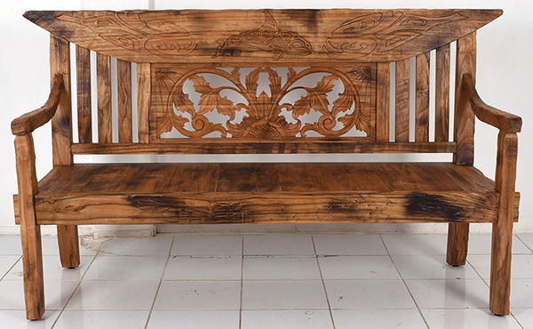 rustic reclaimed wooden bench with handmade carvings