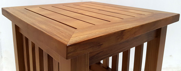 detail of a garden teak side table