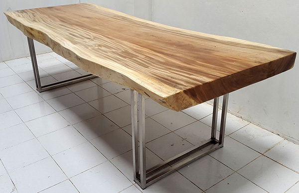 suar dining table with stainless steel legs and natural shaped table top
