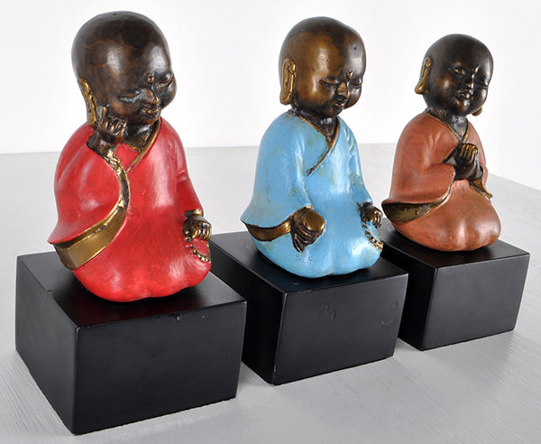 three sitting monks sculpture decor