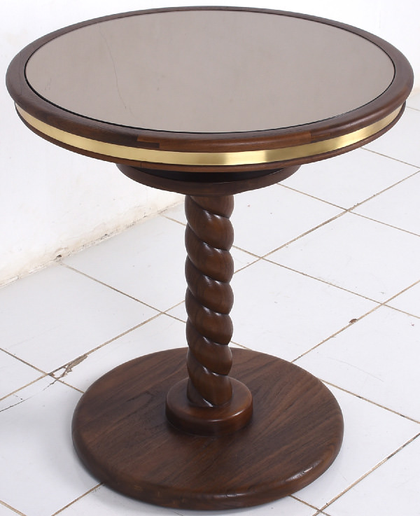 cocktail table with glass mirror top, brass edges and brown carved wooden leg