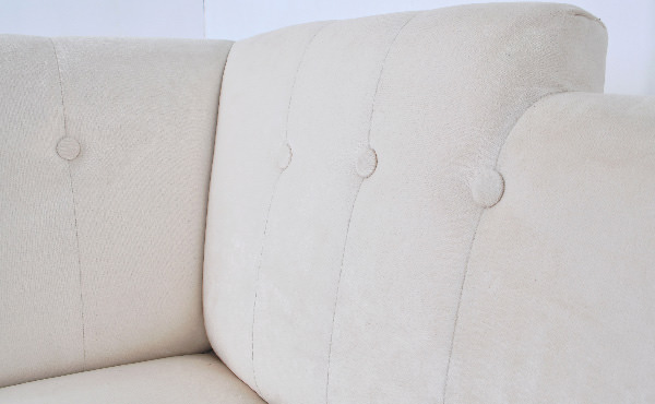 hospitality project white sofa with buttoned upholstery