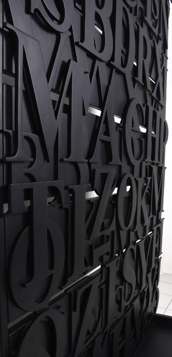 detail of metal divider with iron letters