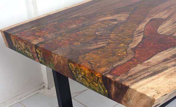 suar wood dining table with resin inserts