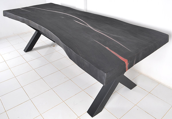 black wooden table with red resin