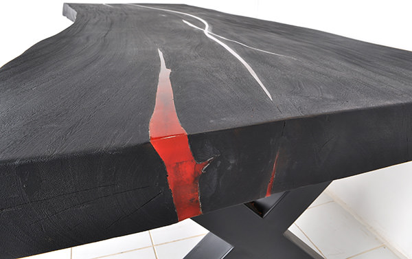 black wooden table with red resin inserts