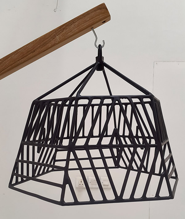 teak and black powder coated iron lamp shade with geometric pattern