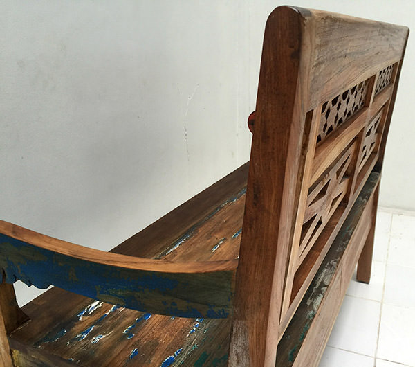 detail of a reclaimed teak bench with boat wood finish