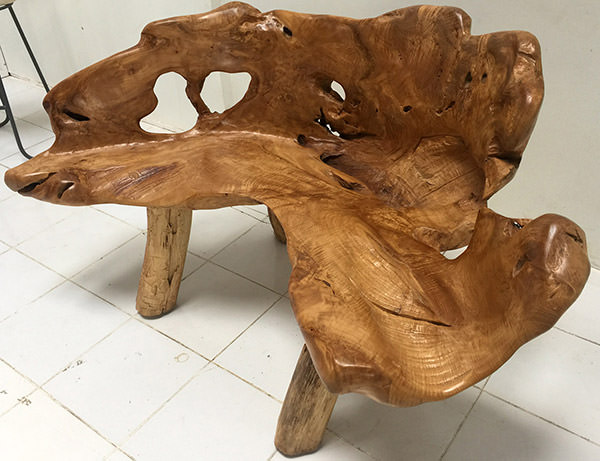 natural teak bench with an organic shape