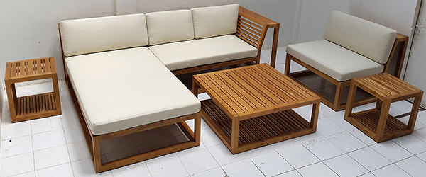 Teak L-shaped sofa with white mattress and square coffee table