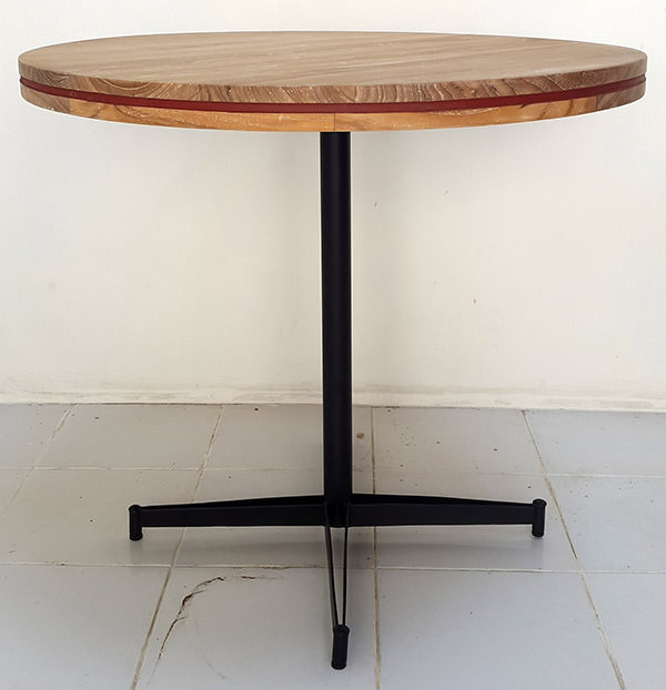 teak round outdoor table with iron legs and painted edge