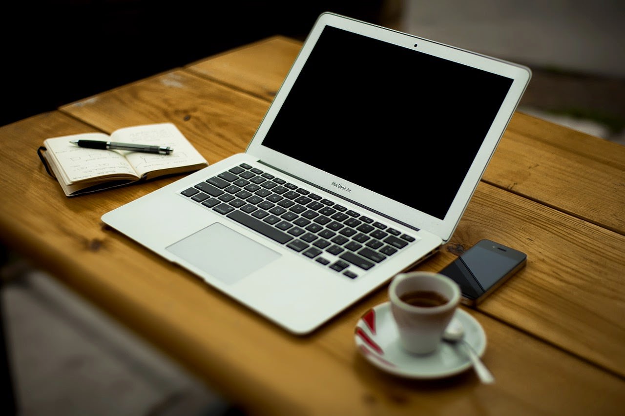 laptop and coffee for guest blogging